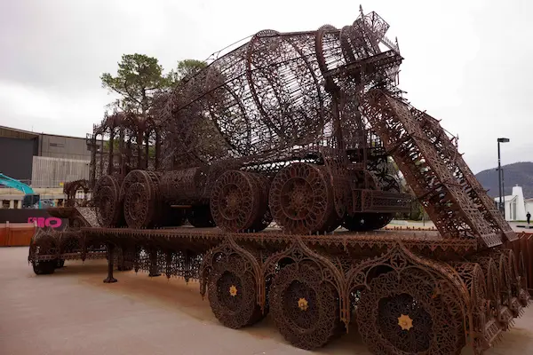 Cement truck on top of flatbed truck (Wim Delvoye)